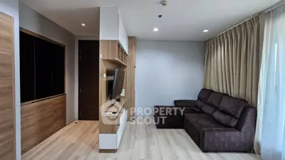 Modern living room with sleek design and cozy seating area