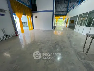 Spacious industrial interior with polished concrete floors and high ceilings