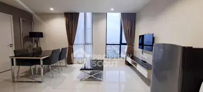 Modern living room with city view, sleek furniture, and elegant decor