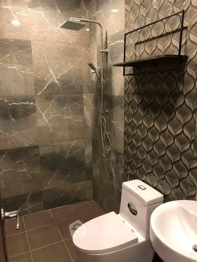 Modern bathroom with elegant tile design and sleek fixtures