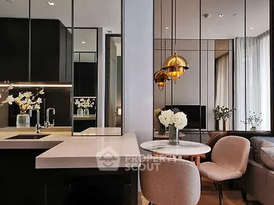 Modern open-plan living room with stylish decor and elegant lighting
