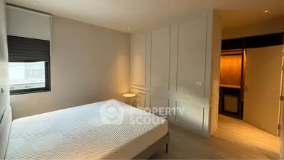 Spacious bedroom with modern design and ample natural light