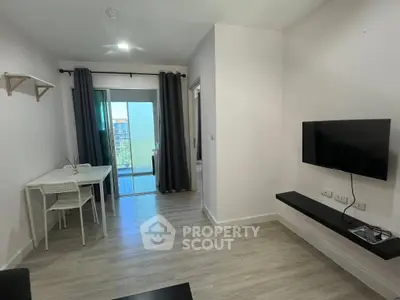 Modern living room with wall-mounted TV and dining area, featuring sleek design and natural light.