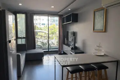 Modern living room with balcony view and sleek interior design