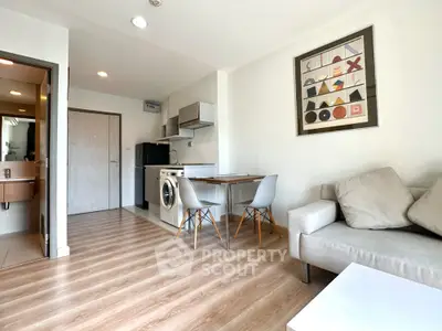Modern living room with stylish decor and open kitchen layout