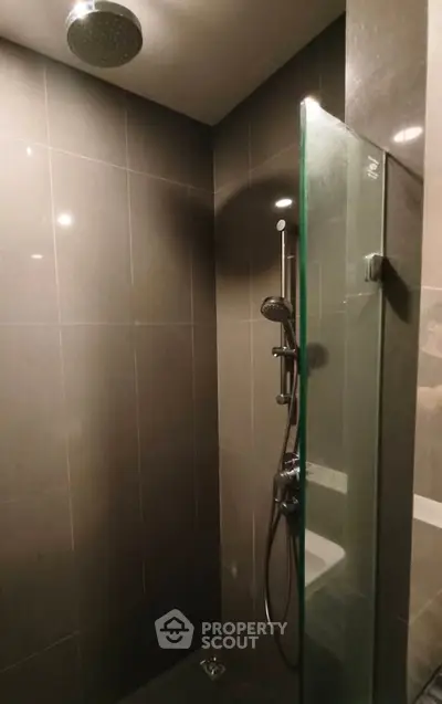 Modern bathroom with sleek shower design and glass partition