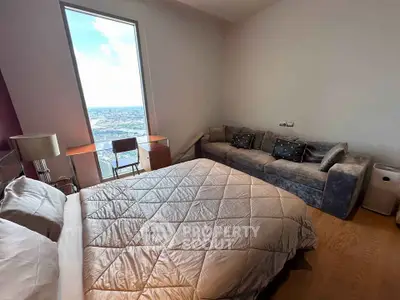Luxurious bedroom with stunning city view and elegant furnishings