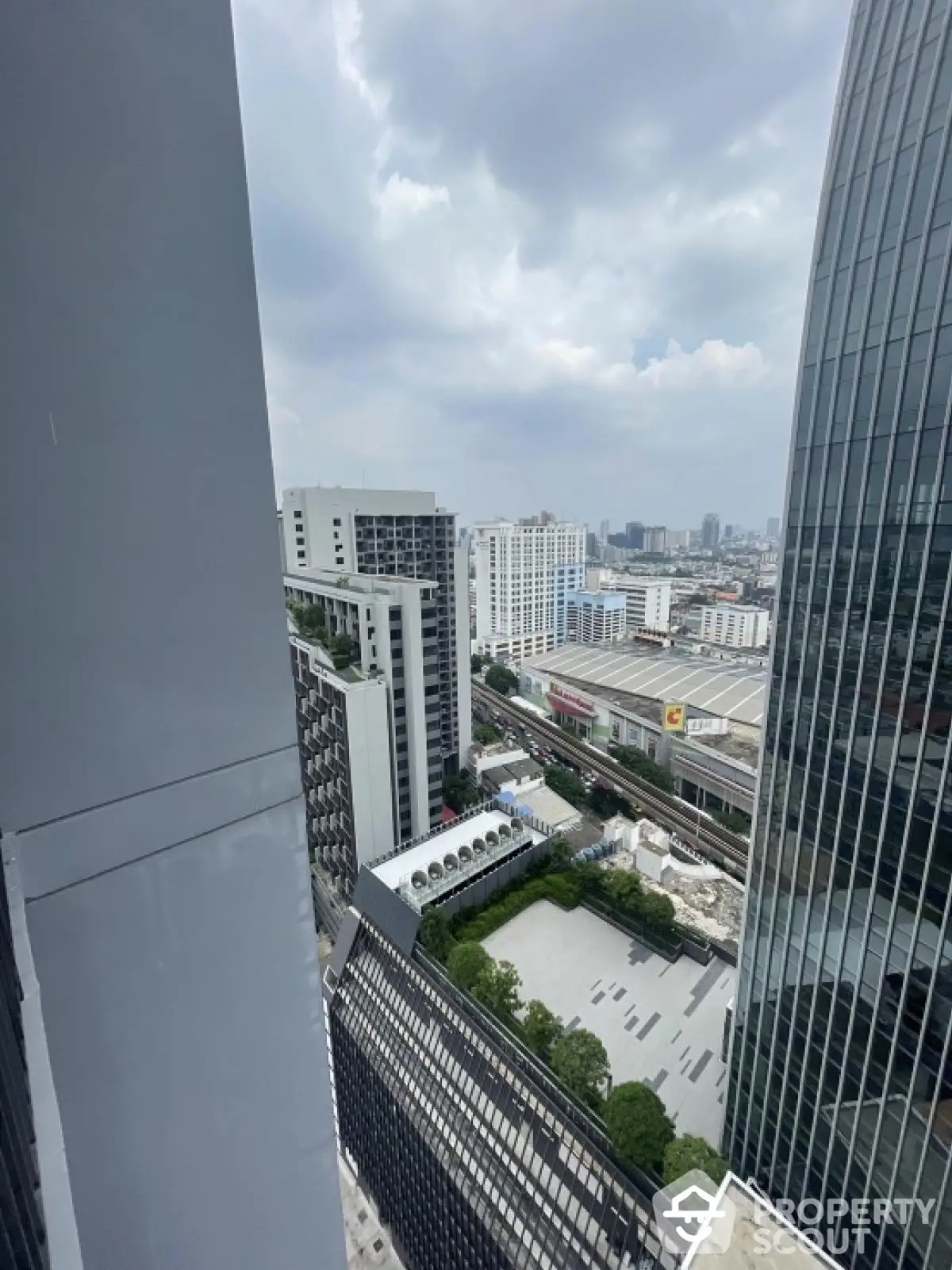 Stunning cityscape view from high-rise building showcasing modern architecture and urban skyline.