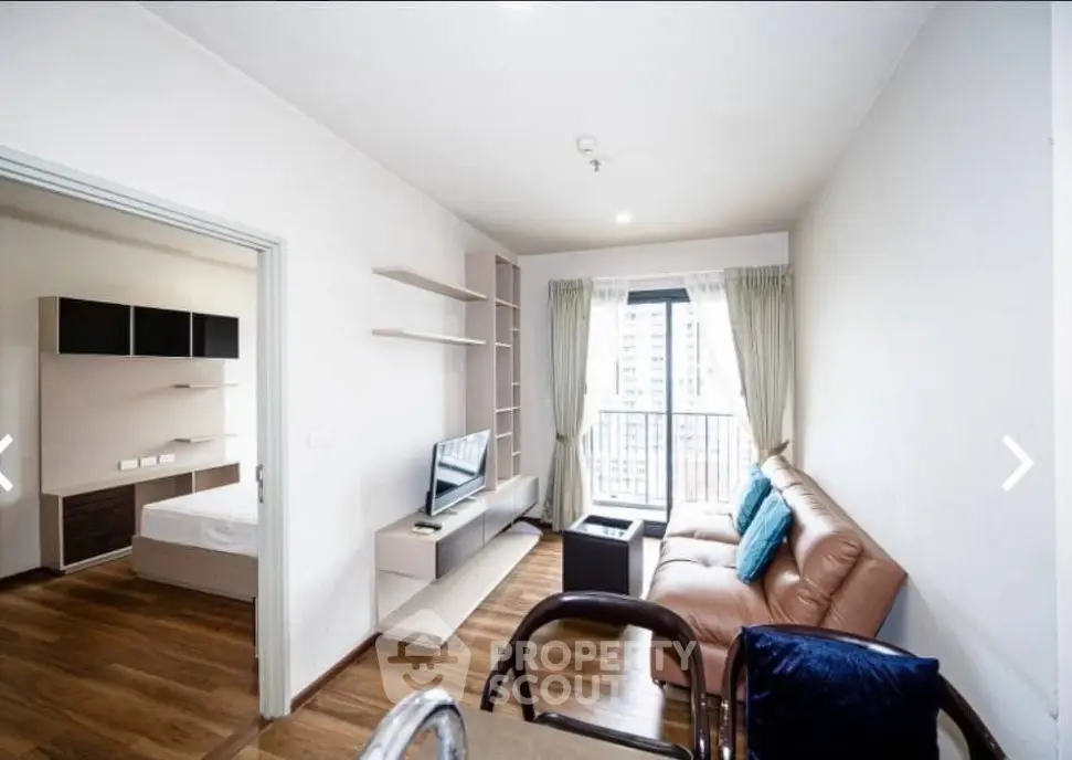 Modern apartment living room with balcony view and cozy furnishings