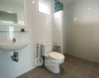 Spacious modern bathroom with sleek fixtures and natural light