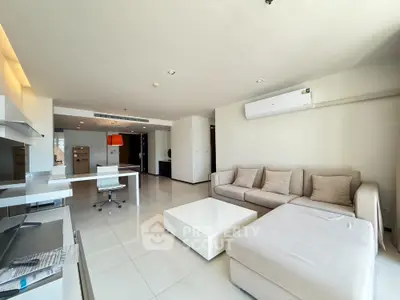 Spacious modern living room with sleek furniture and natural light