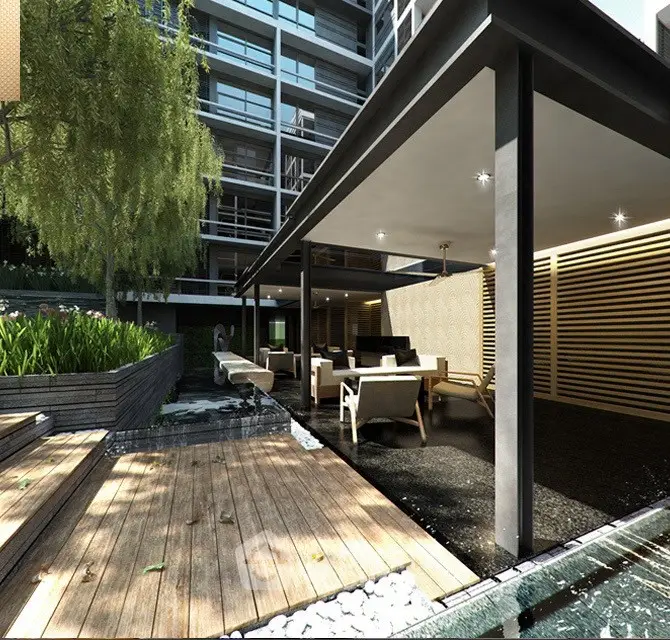 Modern apartment building with stylish outdoor seating area and lush greenery.