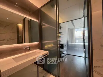 Luxurious modern bathroom with sleek design and elegant fixtures in a high-end apartment.
