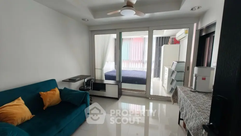 Modern studio apartment with cozy living area and bedroom separation