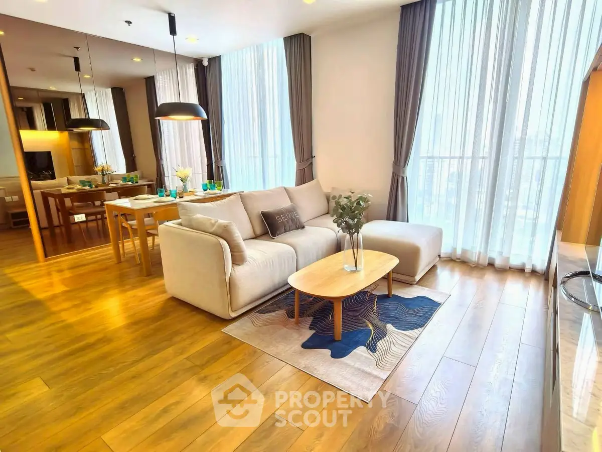 Spacious modern living room with elegant decor and natural light