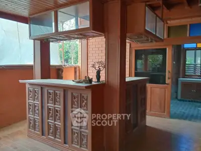 Charming rustic kitchen with wooden cabinetry and open layout, perfect for cozy gatherings.