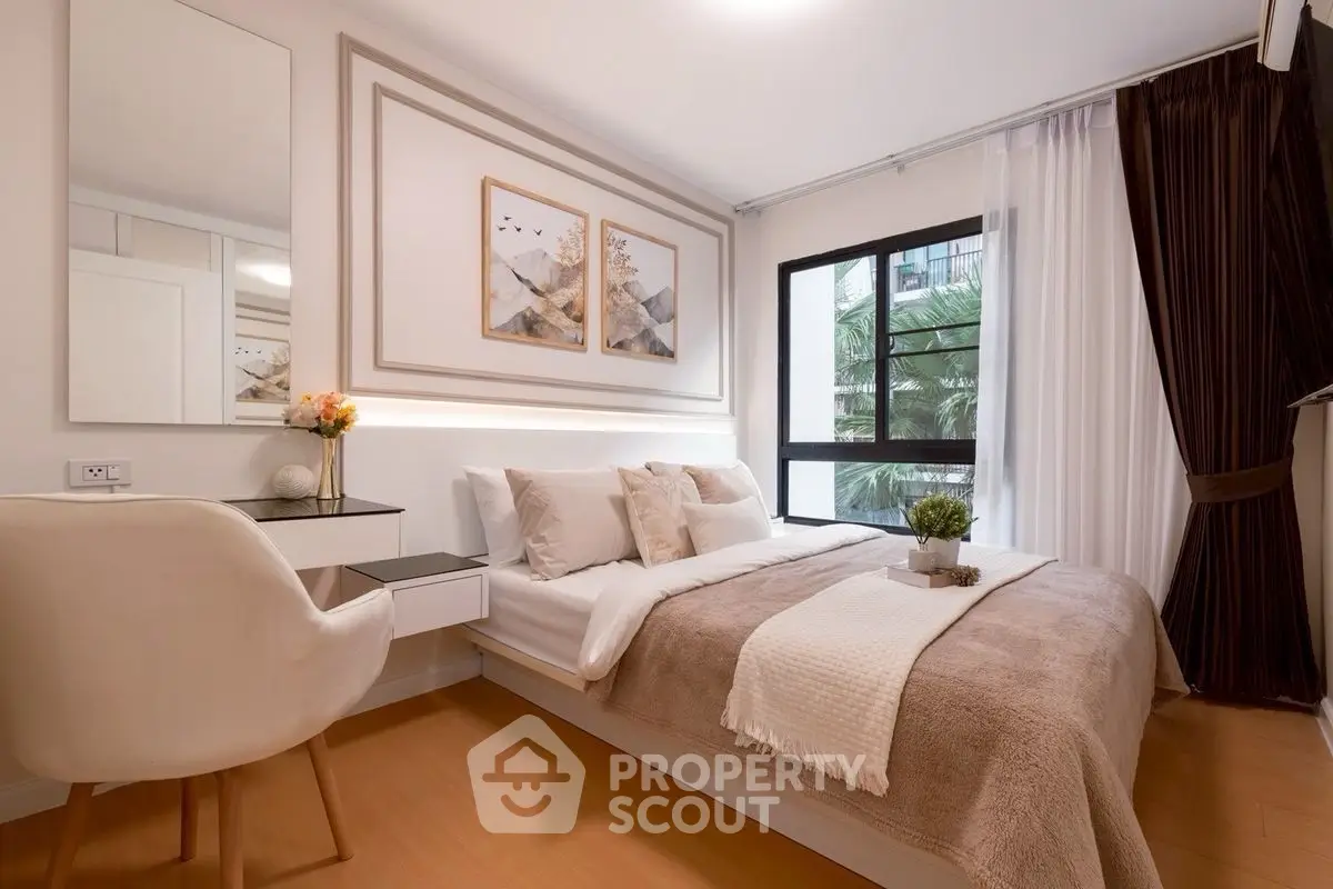 Elegant bedroom with modern decor and large window view