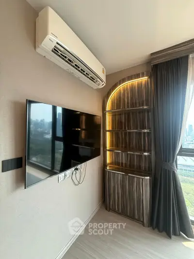 Modern living room with wall-mounted TV and stylish shelving unit