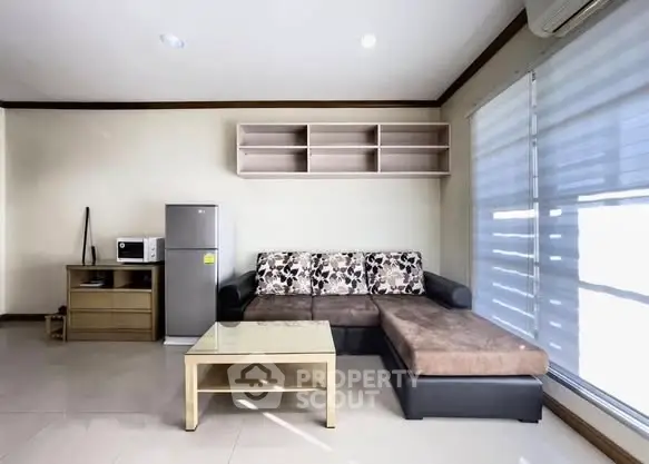 Modern living room with sleek furniture and natural light