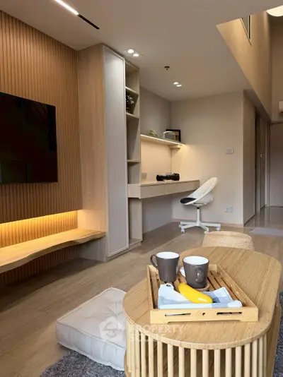 Modern living room with stylish wooden furniture and cozy workspace