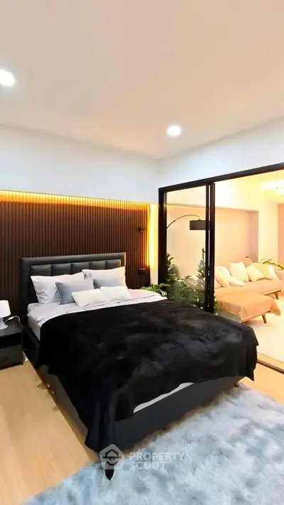 Luxurious bedroom with modern decor and cozy living area view