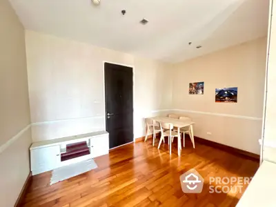 Spacious dining area with wooden flooring and modern furniture