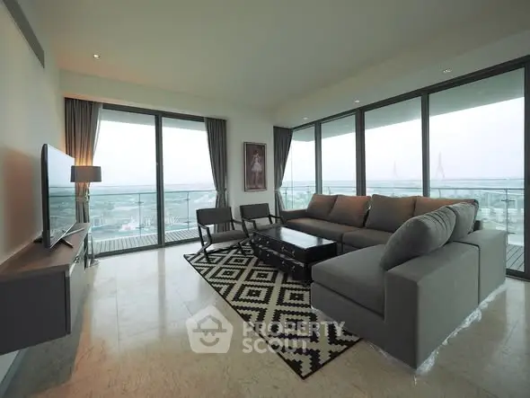 Spacious modern living room with large windows and stunning city view