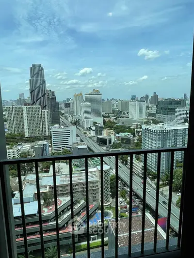 Stunning cityscape view from high-rise balcony in urban setting