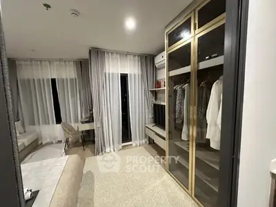 Luxurious bedroom with elegant wardrobe and study area, featuring modern decor and soft lighting.