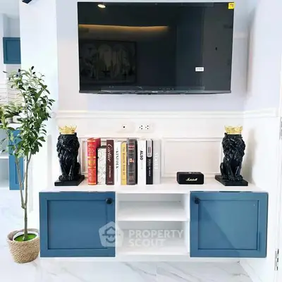 Stylish living room with modern TV setup and elegant decor