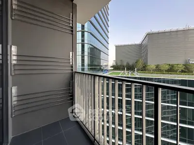 Modern balcony with sleek railing and cityscape view, perfect for urban living.
