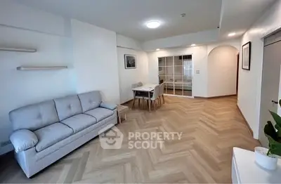 Spacious living room with modern decor and elegant herringbone flooring