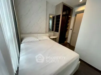 Modern bedroom with sleek design and ample natural light