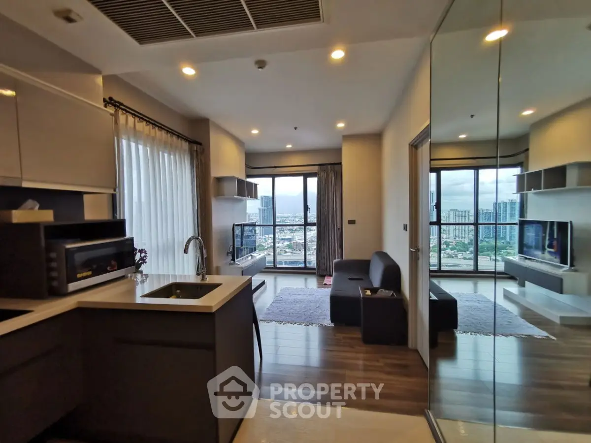 Modern open-layout living room with city view and sleek kitchen design