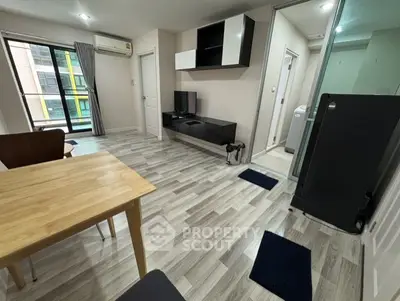 Modern living room with sleek flooring and stylish furniture in a contemporary apartment.