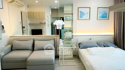 Modern studio apartment with cozy living area and stylish decor