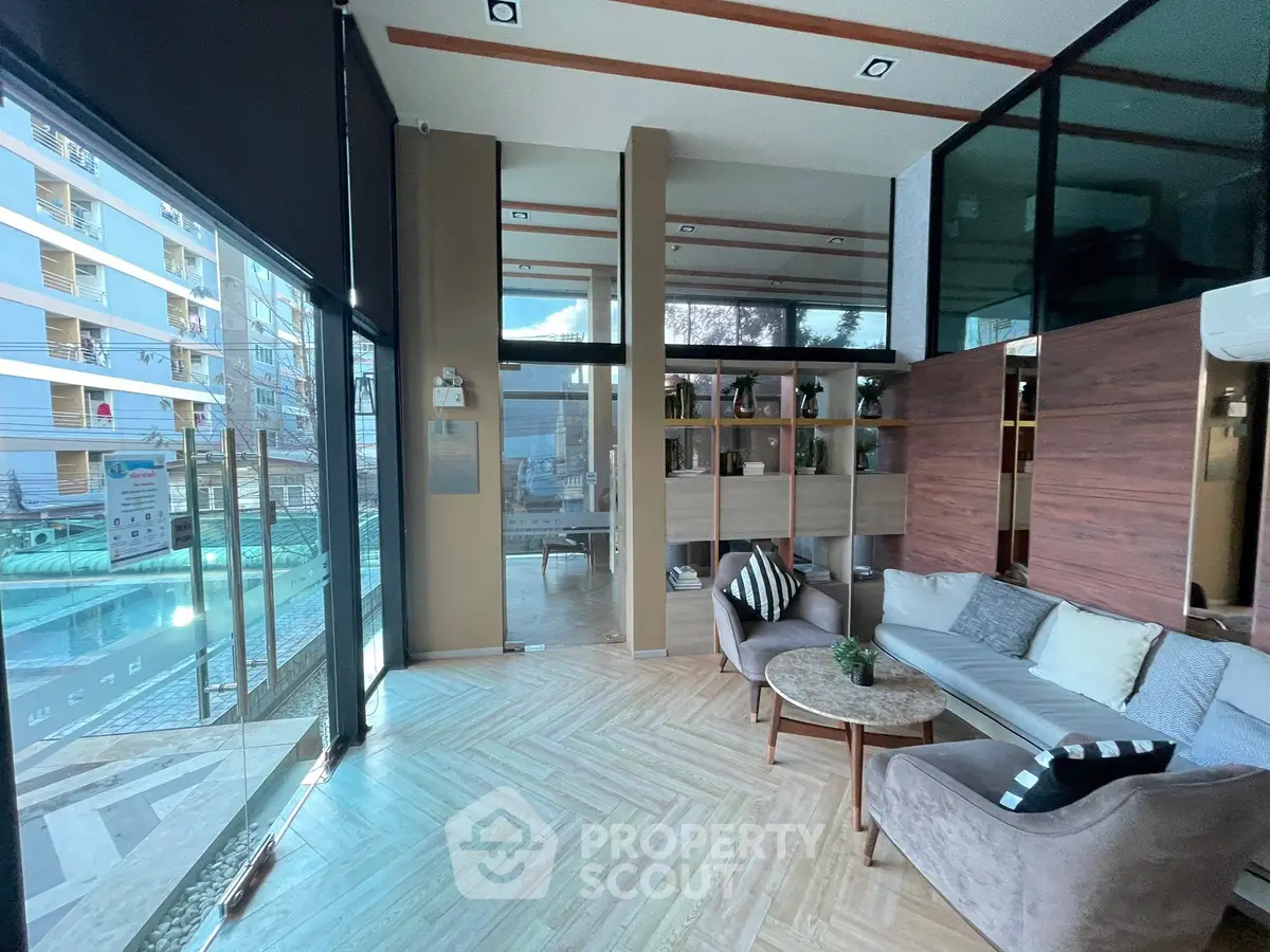 Modern living room with pool view and stylish furniture in luxury apartment