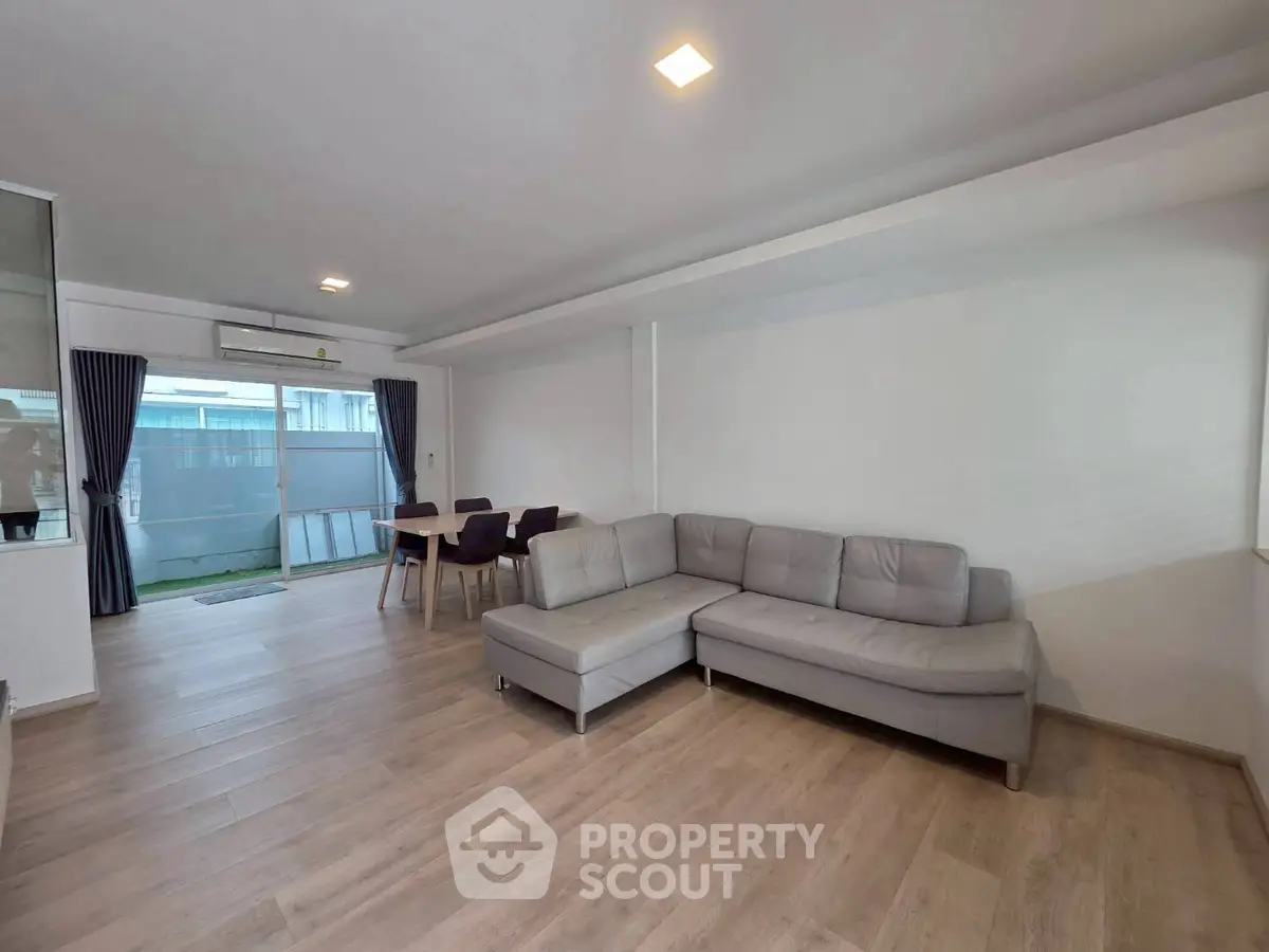 Spacious modern living room with sleek furniture and natural light