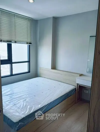 Modern bedroom with natural light and minimalist design