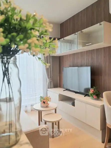 Modern living room with stylish decor and large TV unit