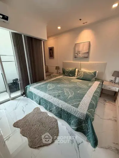 Luxurious bedroom with elegant decor and large windows for natural light.