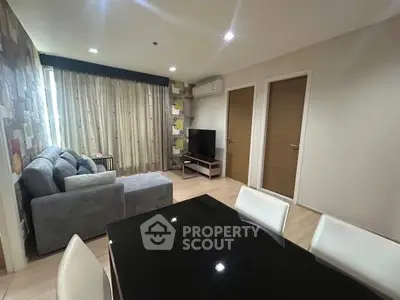 Modern living room with stylish decor and comfortable seating in a cozy apartment.