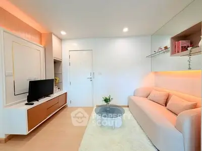 Modern living room with cozy sofa, sleek TV unit, and stylish decor in a bright apartment.