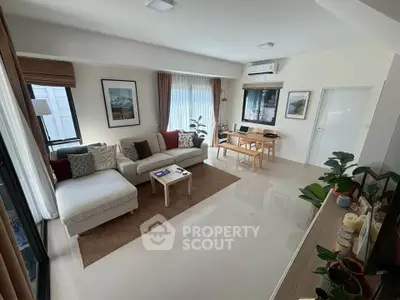 Spacious modern living room with elegant decor and natural light