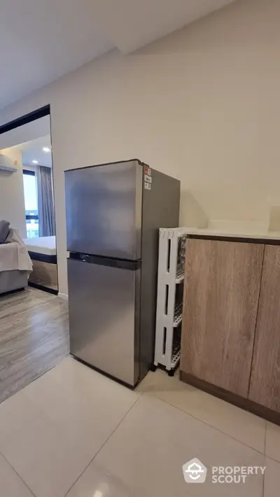 Modern kitchen with sleek stainless steel fridge and stylish cabinetry