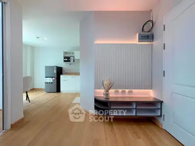 Modern open-plan living space with sleek kitchen and stylish decor