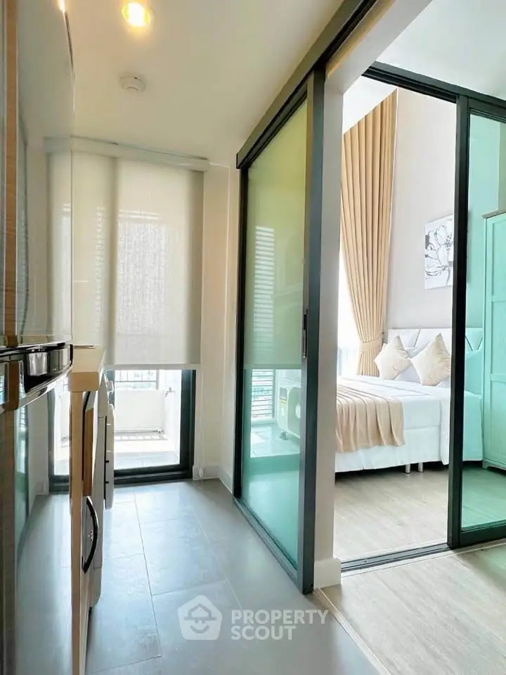 Modern apartment with sleek sliding doors and cozy bedroom view