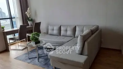 Modern living room with sleek furniture and city view