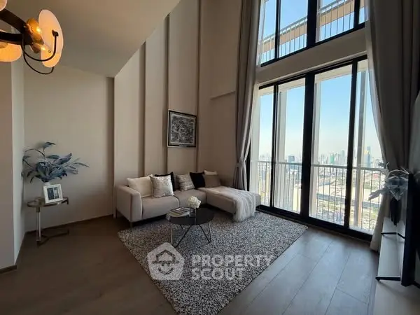 Elegant living room with floor-to-ceiling windows and city view