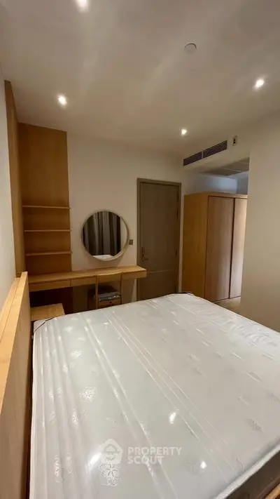 Modern bedroom with minimalist design and wooden furniture